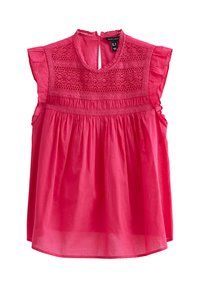 Roze blouse met korte mouwen en een hoge halslijn, kantdetails op het lijfje en een geraffineerde taille. Lichtgewicht stof met een zachte textuur.