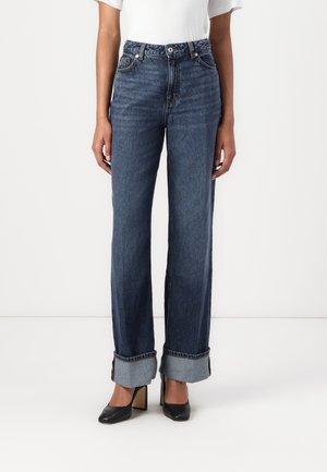 High-waisted, loose-fit blue jeans with cuffed hems, made of denim, featuring contrast stitching and a classic button closure.