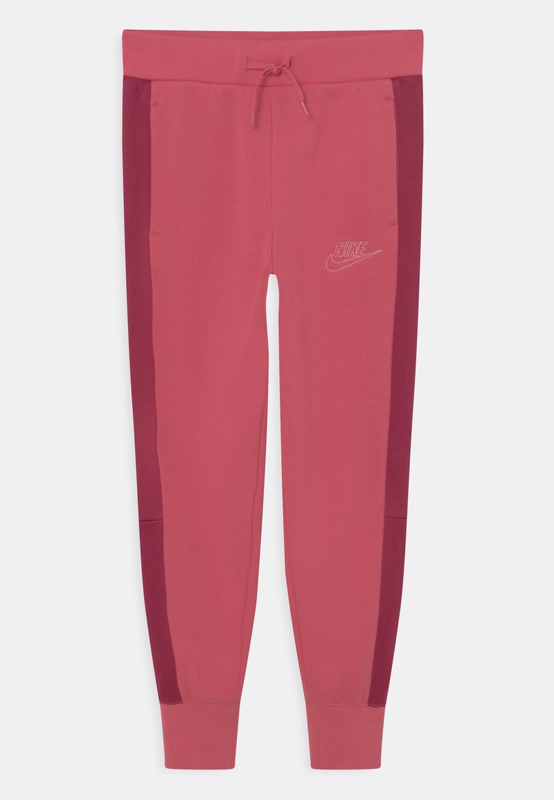 Růžové tepláky s tmavšími růžovými bočními panely, elastickým pasem se stahovací šňůrkou a jemným logem Nike na přední straně.