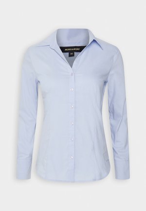 Himmelblaues Button-Up-Hemd mit langen Ärmeln, spitzen Kragen und subtiler glänzender Oberfläche. Verfügt über Frontknöpfe und einen abgerundeten Saum. Größe 36.