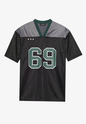 Maillot en mesh noir avec des accents gris, lettrage vert "69" et trois étoiles au-dessus du décolleté. Manches courtes et design en V.