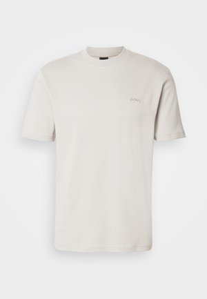Plain light beige short-sleeve crew neck T-shirt with small "BOSS" logo embroidered on the left chest.