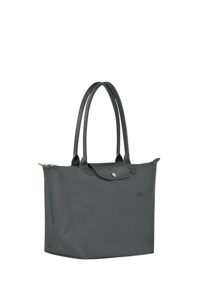Gray tote bag with textured handles, zipper closure, and a snap button. Features a small logo and a green accent near the handle.