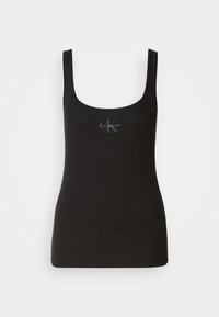 Débardeur noir à côtes avec décolleté carré, arborant un logo Calvin Klein ton sur ton à l'avant. Fabriqué en coton extensible.