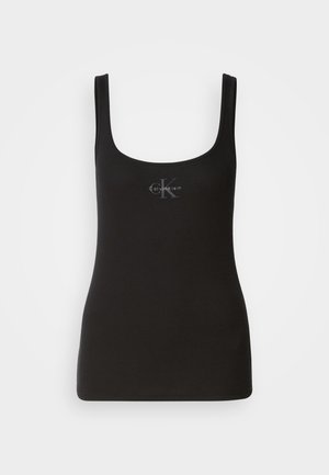 Černý žebrovaný top bez rukávů se čtvercovým výstřihem, na přední straně s tonálním logem Calvin Klein. Vyrobeno z elastického bavlněného materiálu.