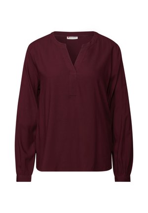 Blouse bordeaux à manches longues avec un col en V, fabriquée en tissu lisse. Elle dispose de poignets froncés et d'un ourlet droit pour une coupe décontractée.