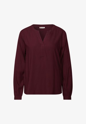 Blouse bordeaux à manches longues avec un col en V, fabriquée en tissu lisse. Elle dispose de poignets froncés et d'un ourlet droit pour une coupe décontractée.