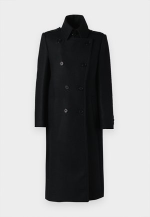 Must mustra kaheline jope kõrge kraega, kahe küljetaskuga ja nööpide kinnitusega, millel on kohandatud lõige ja sirge siluett.