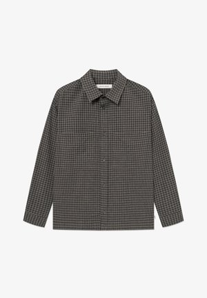 Dark plaid shirt with long sleeves, button-up front, and a classic collar. Made of textured fabric with a grid pattern in neutral tones.