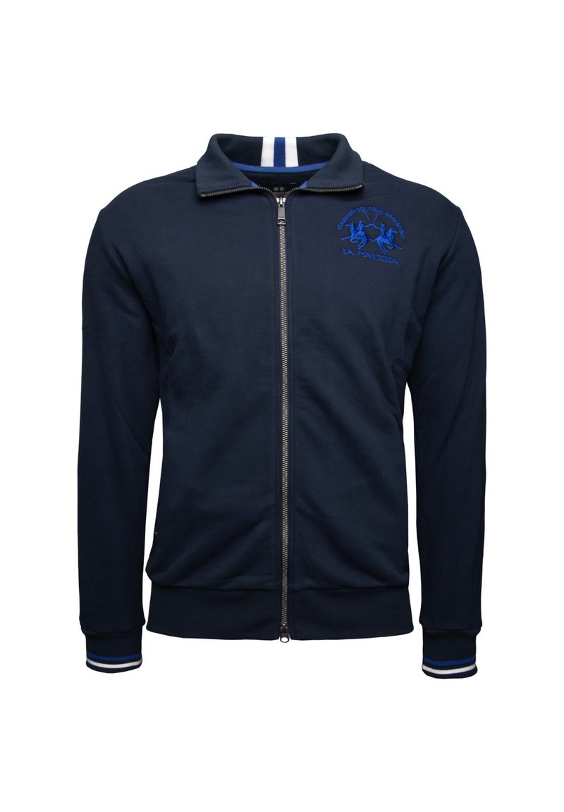 Navy blue zip-up jacket in soft fabric, featuring a raised collar, white-striped accents, and an embroidered logo in blue on the chest.