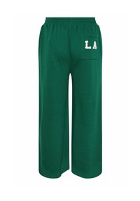 Grüne weit geschnittene Hose aus weichem Stoff, mit einem elastischen Bund und einer Gesäßtasche mit besticktem "LA"-Detail.