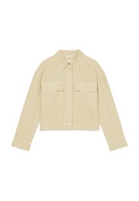 Cropped beige shirt jacket made of cotton with a point collar, front button closure, and two chest flap pockets. Smooth texture, slightly oversized fit.