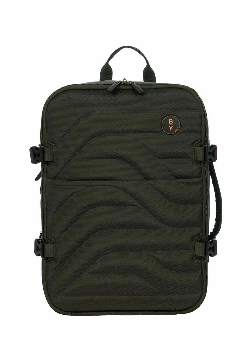 Zaino imbottito verde oliva con un design a onde testurizzato, dotato di zip nere a contrasto, manico superiore e spallacci laterali regolabili.