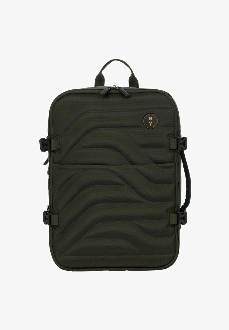 Zaino imbottito verde oliva con un design a onde testurizzato, dotato di zip nere a contrasto, manico superiore e spallacci laterali regolabili.