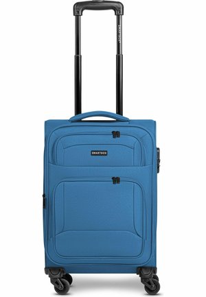 Blue upright soft suitcase with four wheels, two front zippered pockets, and black extended telescopic handle.