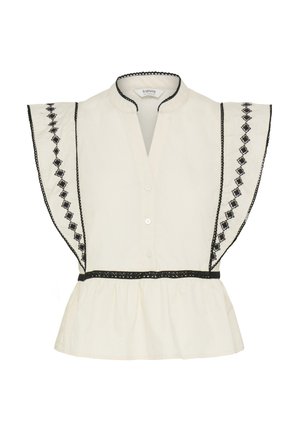 Blusa color crema con maniche a sbuffo arricciate, con ricamo a diamante nero, rifinitura nera sul colletto e in vita, e chiusura frontale con bottoni.