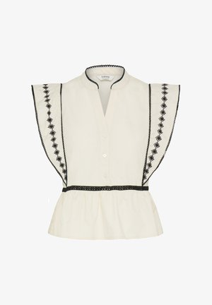 Blusa color crema con maniche a sbuffo arricciate, con ricamo a diamante nero, rifinitura nera sul colletto e in vita, e chiusura frontale con bottoni.