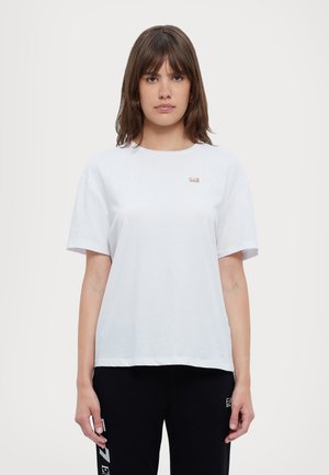 T-shirt bianco in cotone con maniche corte, collo rotondo e un piccolo logo sul lato sinistro del petto. Progettato per una vestibilità comoda.