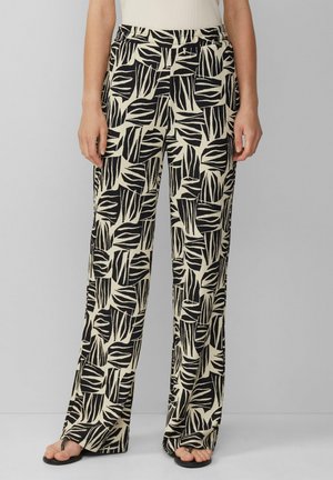 Pantaloni a gamba larga beige con motivi a foglia nera; tessuto strutturato; cintura elastica; caduta leggera; vestibilità ampia dalla vita all'orlo.