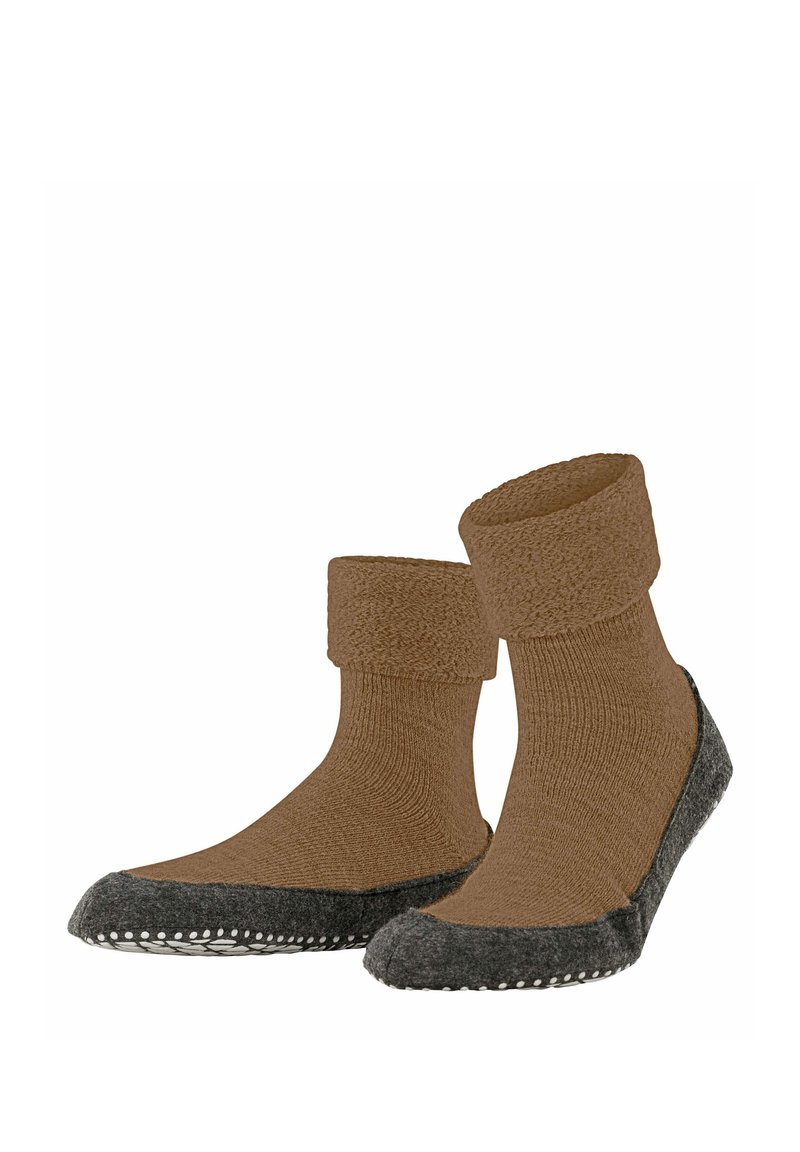 Brązowe wełniane skarpetki z teksturowanym, złożonym mankietem i ciemnoszarymi, filcowymi podeszwami z małymi białymi kropkami wzdłuż krawędzi.