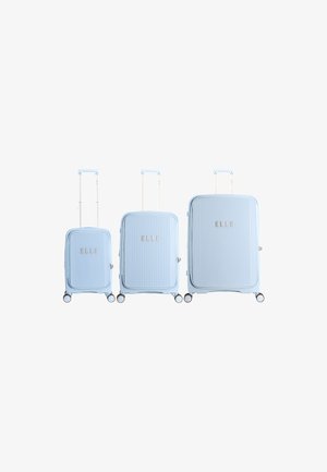 Three light blue hard-shell suitcases with extendable handles and four wheels, arranged from smallest to largest, displaying the brand "ELLE".