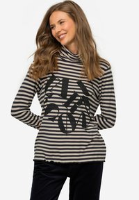 Gestreiftes Langarmoberteil in Creme und Marineblau, mit einem schwarzen Grafikdesign. Stehkragen und gewellte Saumdetails. Weiches Baumwollmischgewebe.