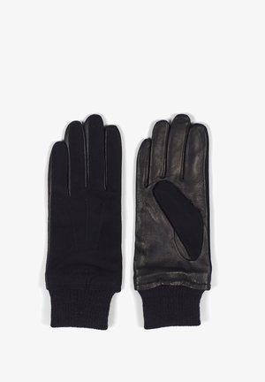 Guantes de cuero negro con puños de tela acanalada, que cuentan con un acabado suave, diseño de cinco dedos y sencillos detalles de costura.