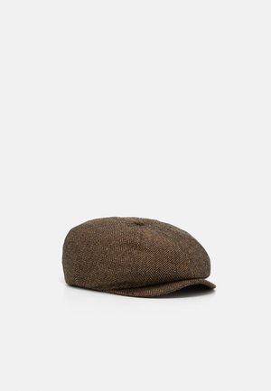 Bruine herringbone platte pet met een korte, gebogen klep, weergegeven op een witte ondergrond tegen een effen lichte achtergrond.