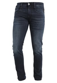 Mörkblå denimjeans med smal passform, femficksdesign, dragkedja och metallknapp. Mjuk textur med lätt blekning.