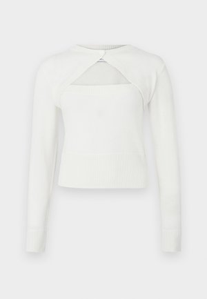 Biely sveter s dlhými rukávmi, rebrovaným lemom a výrezom na chrbte. Vyrobený z mäkkého materiálu, s okrúhlym výstrihom a gombíkovým zapínaním.