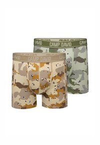 Two pairs of boxer shorts in camo patterns. One is beige with brown accents, the other in green tones. Both have "CAMP DAVID" waistband.