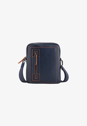 Navy leather crossbody bag with orange piping, zippered front pocket, rectangular shape, and adjustable strap. Smooth texture and sleek design.