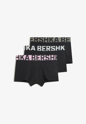 Pack de trois boxers noirs avec des ceintures élastiques en vert foncé, rose clair et gris clair, arborant le texte logo "BERSHKA".