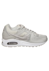 Grey athletic shoes featuring a mix of textured mesh and smooth leather. The design includes a visible air cushioning unit and lacing system.