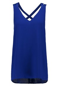 Blå ärmlös topp med V-ringning och korsande banddesign. Slätt tyg med en lös passform och något böjd fåll.