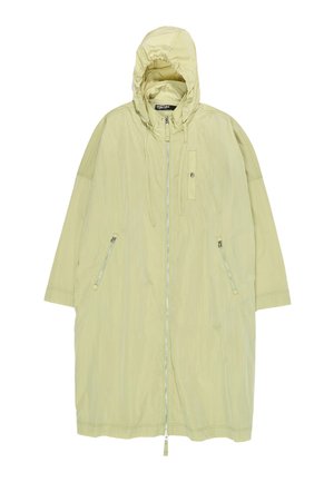 Lange lichtbeige gewatteerde jas met capuchon, voorzien van een voorrits, twee zijritszakken en verstelbare koordjes aan de capuchon.