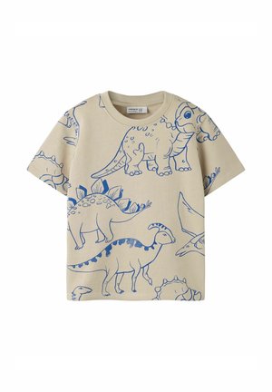 Beige kortærmet toddler-skjorte med blå konturtegnede billeder af forskellige dinosaurer, herunder en stegosaurus og en triceratops.