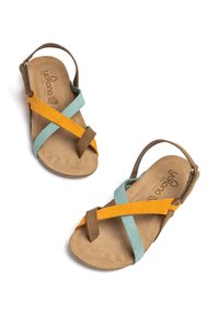 Multi-colored sandals with a brown base, featuring aqua, yellow, and brown straps crossed over a textured, light tan footbed.