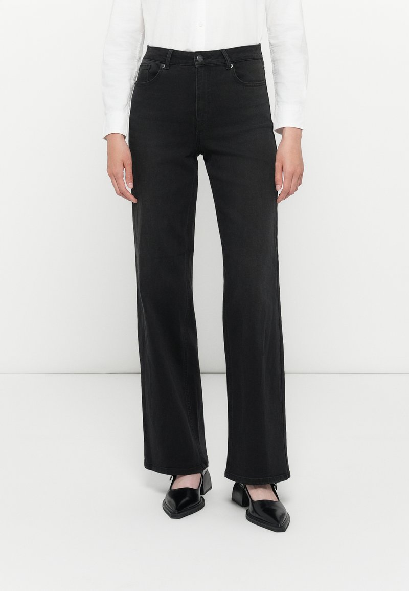 Black denim high-waisted jeans with a straight leg fit, featuring belt loops, front pockets, and a button closure. Smooth texture, minimal detailing.