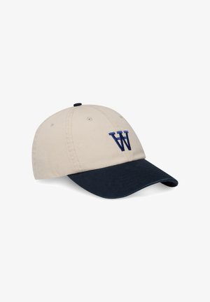 Beige Baumwollmütze mit einem Marineblauen Schirm. Verfügt über ein gesticktes Marineblaues "W"-Logo auf der Vorderseite. Hat Belüftungsösen und einen verstellbaren Riemen.