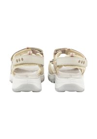 Sandalias beige con correas ajustables, suela blanca y plantilla texturizada. Presenta acentos en rosa y crema, así como agujeros de ventilación en las correas.