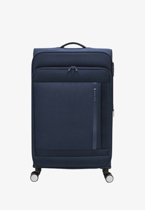 Valigia rigida blu navy con texture liscia, doppie cerniere, tasca frontale e quattro ruote girevoli per la mobilità.