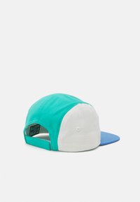 Cap featuring a teal body, white front panel, and blue brim. Made of fabric with a smooth texture and adjustable strap at the back.