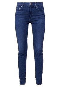 Tmavě modré skinny džínsy z denimu s polo-vysokým pasem, pěti kapsami a kontrastním šitím. Hladká textura s minimálním opotřebením.