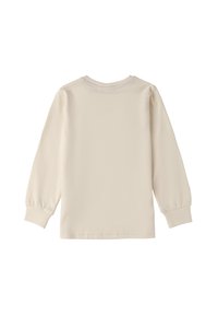 Maglietta a maniche lunghe in cotone morbido di colore bianco sporco, con scollatura rotonda e maniche arricciate, e un retro semplice.