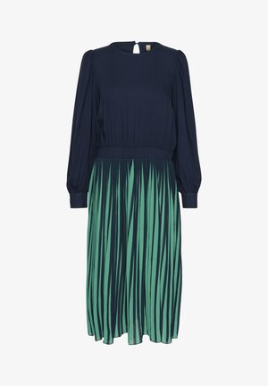 Sukienka z granatową górą i spódnicą w zielone paski. Posiada długie rękawy i detal w kształcie dziurki na plecach. Wykonana z lekkiego materiału.