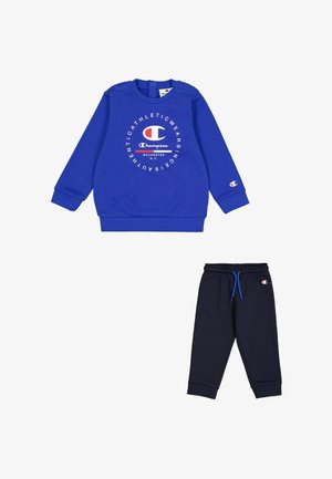Sudadera de algodón azul con cuello redondo y estampado de logo, combinada con pantalones de chándal de color marino que cuentan con una cinturilla elástica y cordón azul.