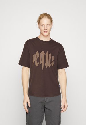 Brown cotton t-shirt with short sleeves and a crew neckline, featuring a stylized beige logo on the front. Smooth texture, relaxed fit.