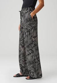 OPUS - Spodnie materiałowe