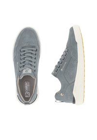 Gray suede sneakers with a white sole, featuring a lace-up design, perforated details, and branding on the side and tongue.